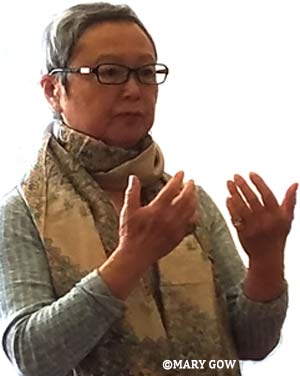 Flo Oy Wong speaking at an Asian American Women Artists Association meeting. Photo by Mary Gow