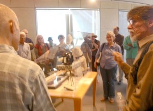 Thomas Ingmire (right) leads a talk about the Friends of Calligraphy's Kalligraphia 13 Exhibition at the Skylight Gallery of the San Francisco Public Library